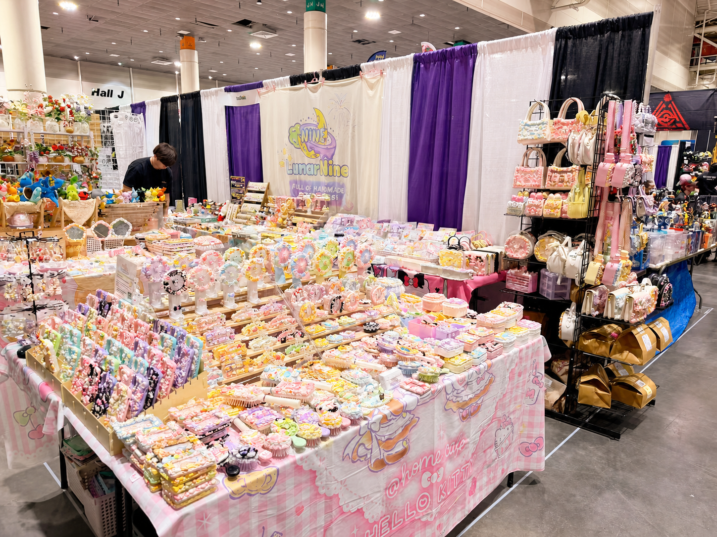 LunarNine booth filled with colorful Decoden creations at Fan Expo New Orleans